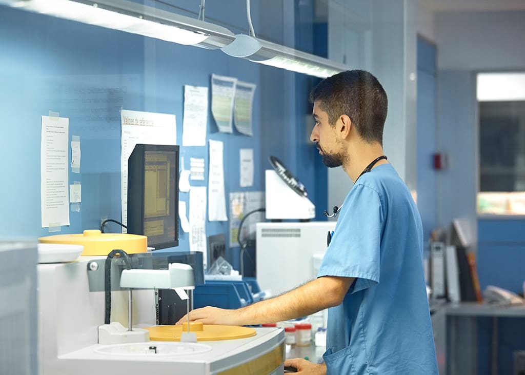 Clinical staff member working at lab computer - Zoetis